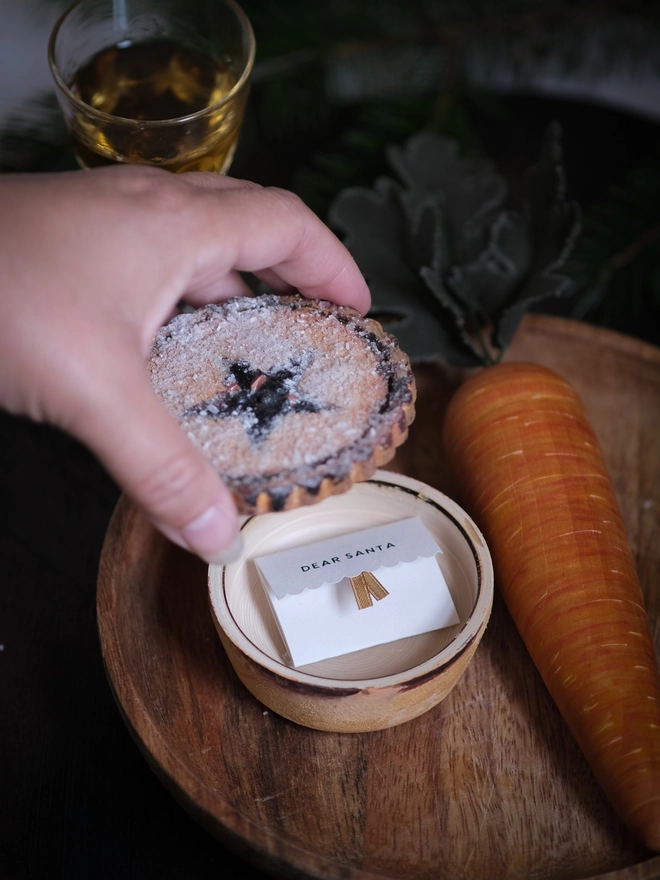 A festive handpainted wooden mince pie designed to become part of your family’s Christmas Eve tradition, with a special place for a note to Santa.
