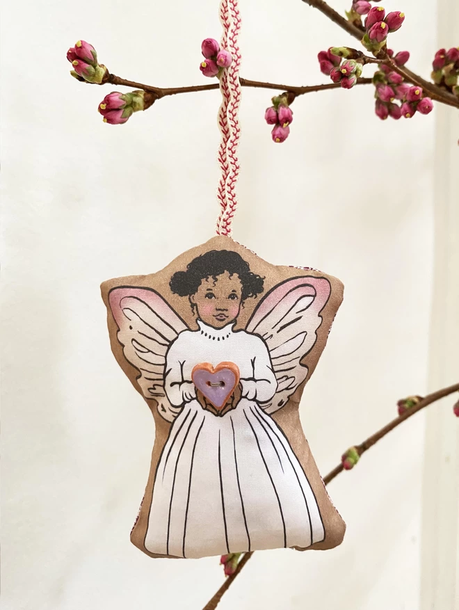 lavender fairy called Lola hung on a blossom branch