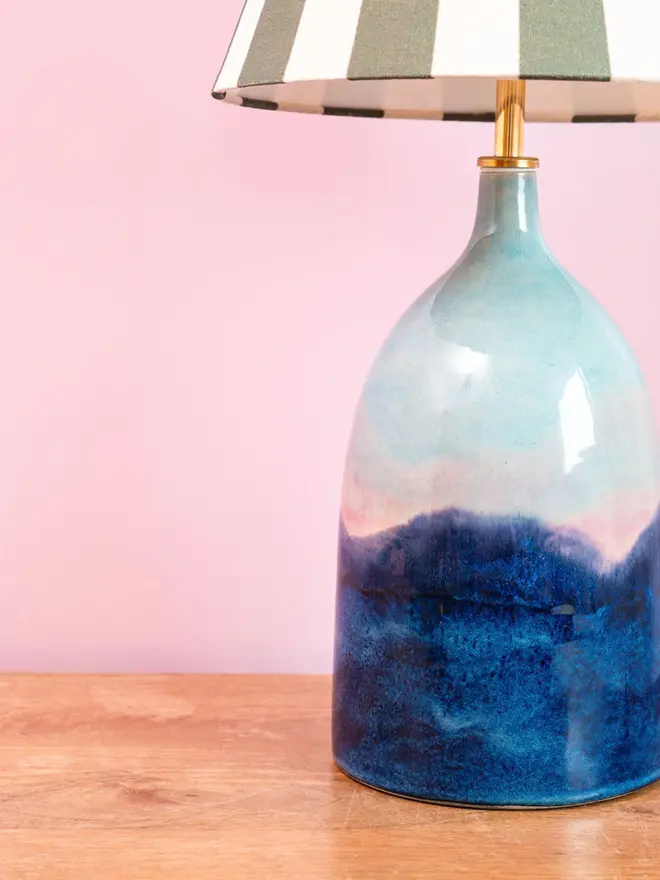 Bottle lamp with shades of blues and pinks