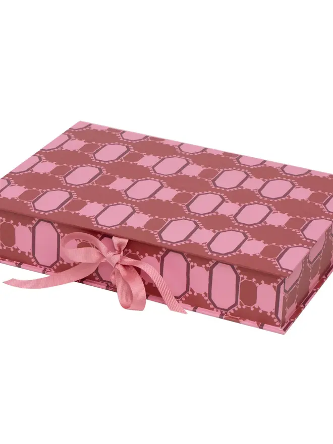 Lidded Portfolio Box, a colourful portfolio box sitting on a plain surface. 