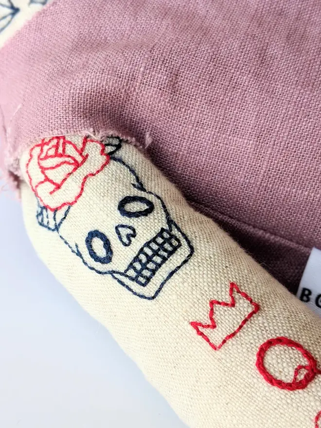 tattooed bear doll. aa cream linen bear doll with embroidered arm tattoos and a pink waistcoat.