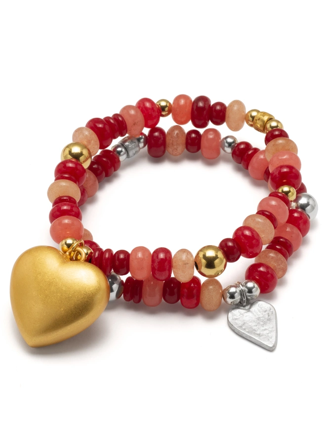 vibrant red and soft pink jade beads for a joyful pop of colour. Finished with a charm of your choice, this stretch bracelet is made to lift your mood and your look. 