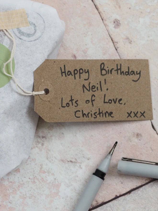 Hand written gift tag for personalised leather gifts