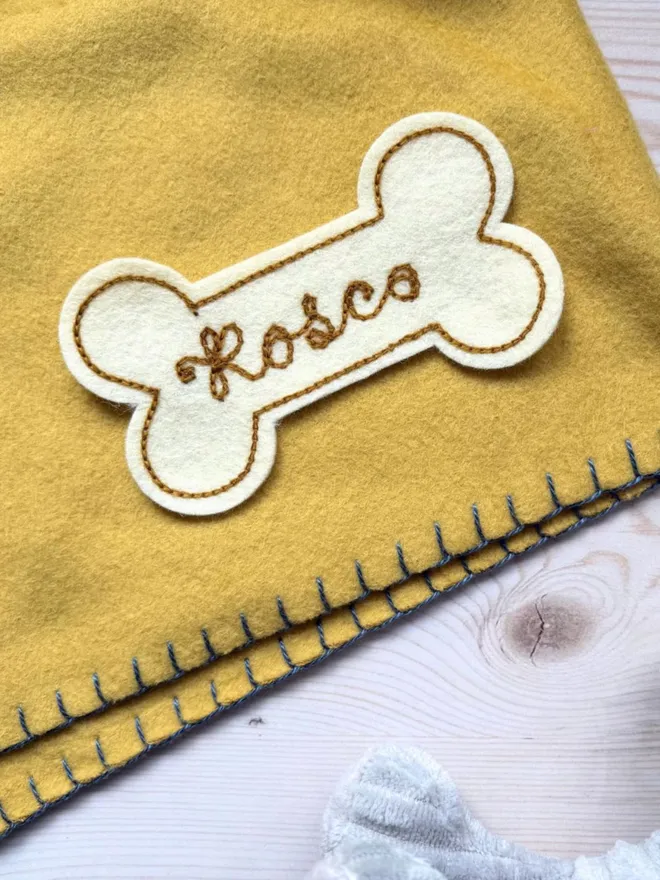 Personalised embroidered dog name patches in cream