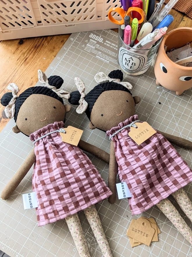 fabric dark skin doll with black braided hair 