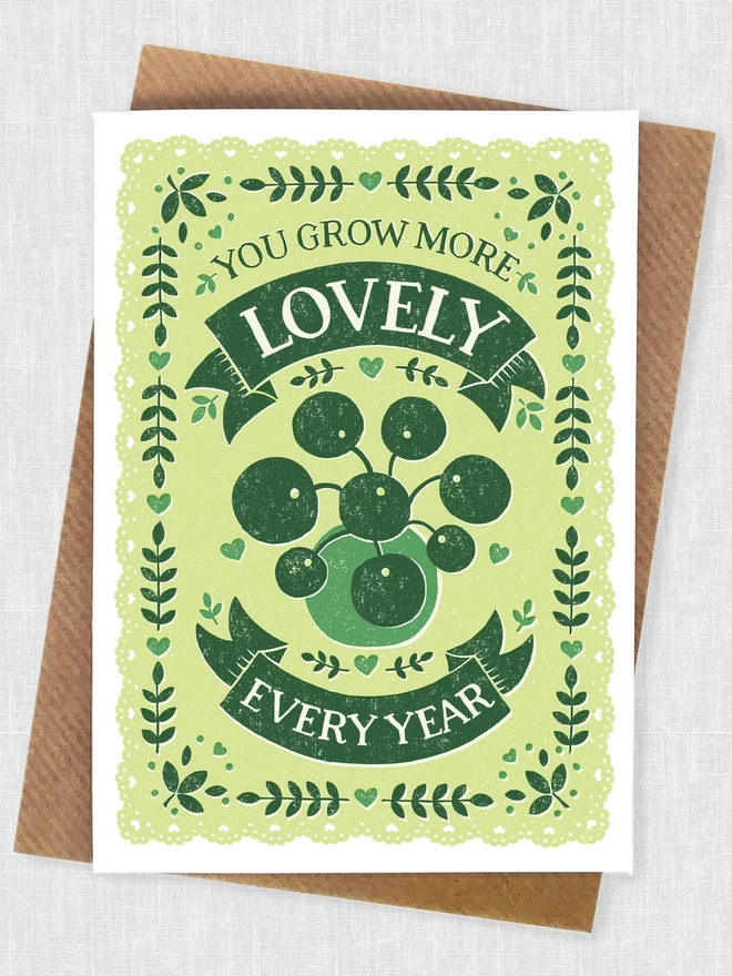 green chinese money plant birthday card with brown kraft envelope