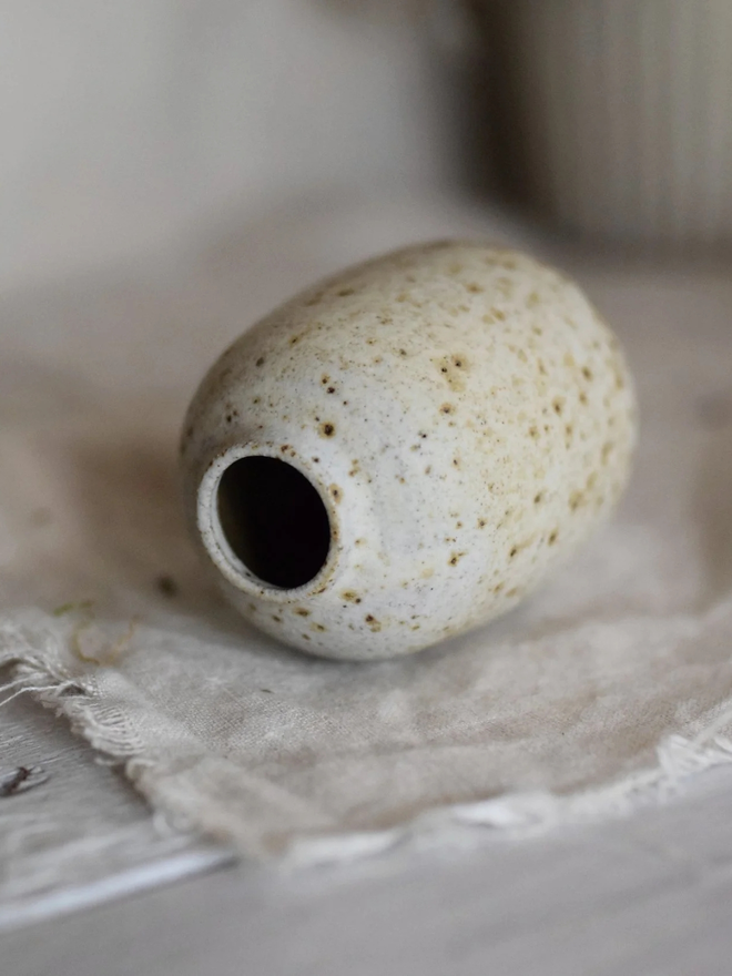 Stoneware bud vase. A small stoneware handmade bud vase with a speckled glaze