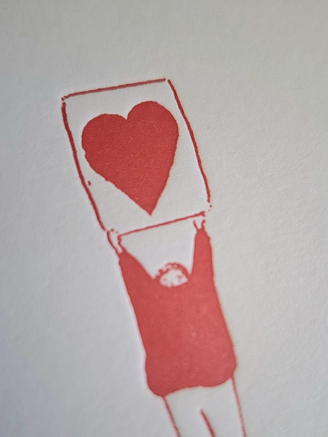 Heart Letterpress Handprinted Greetings Card, a white heart card with a red design. 