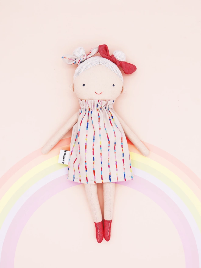 rainbow girl doll with colourful hair and dress 