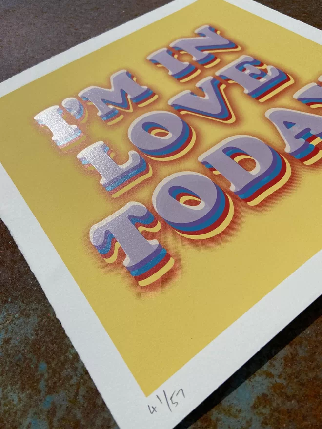 "I'm In Love Today" Hand Pulled Screen Print with deckled edges yellow background and the words I’m in love today printed on top in white with rainbow shading 