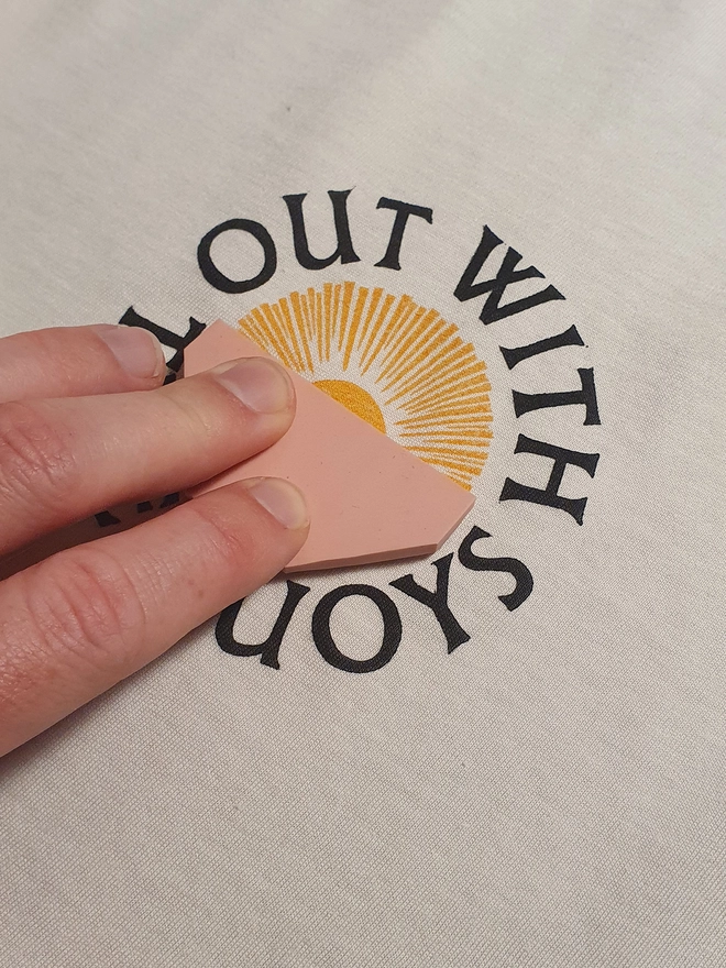 Printing the t-shirt design using a linocut block