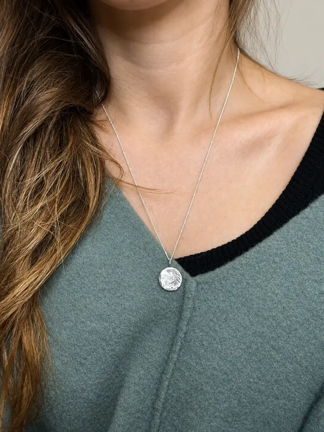 Handmade recycled sterling silver moon pendant necklace with organic sand-cast texture on a delicate satellite chain, inspired by the phrase ‘Love you to the moon and back’. Personalised gift jewellery by Celina C Jewellery, a small UK business, find on Holly and Co.