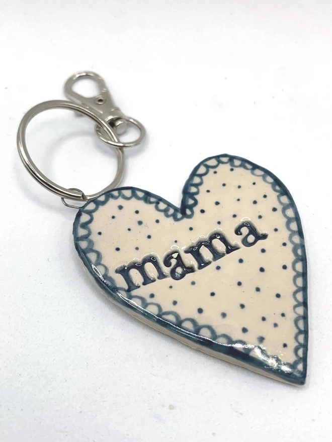 Mama Heart Ceramic Keyring, a blue keyring sitting on a plain white surface. 