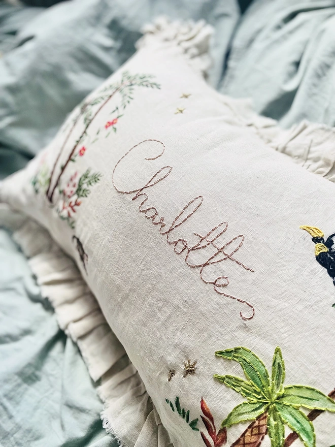 Hand Embroidered Tropical Jungle cushion on natural linen with personalised name 