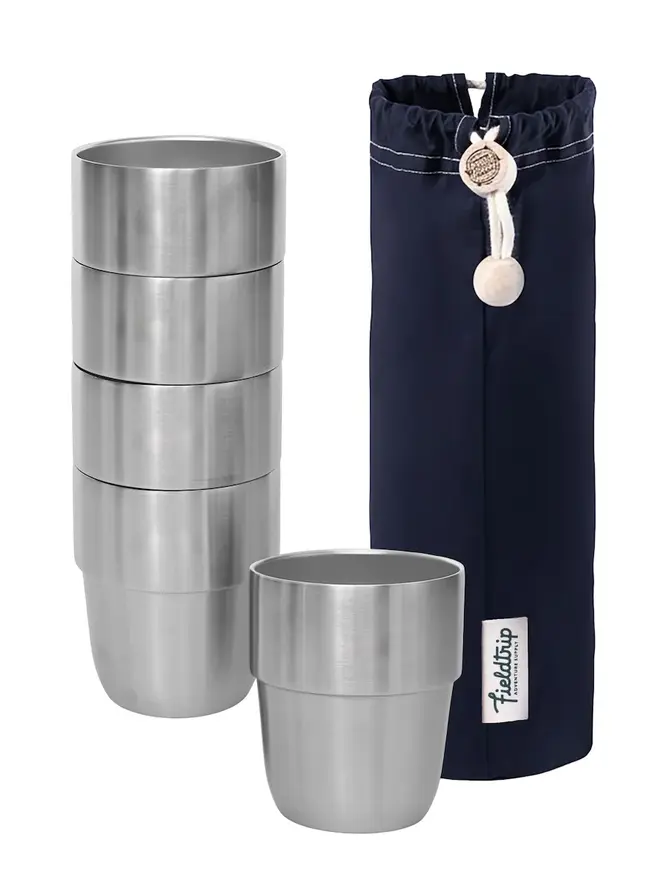 'expedition' stainless steel stacking cups set. a set of stainless steel cups, photographed next to a navy blue drawstring bag.