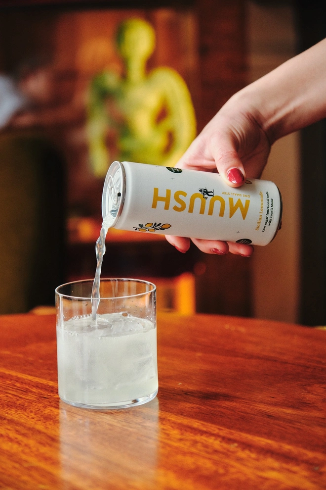 can of sicilian lemon drink being poured into a glass