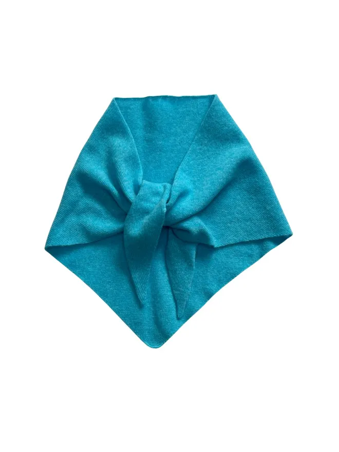 Turquoise triangle scarf shown flat folded on a white background