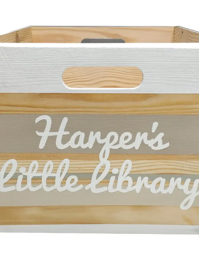 personalised children's book storage box. a wooden box with personalised colours and text for children to store books.