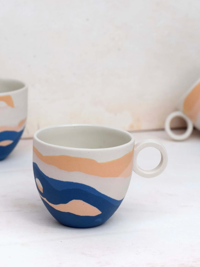 Shore Dreamlands Espresso Cup. A selection of cups from the Shore Dreamlands collection, showing typical variation in decoration.
