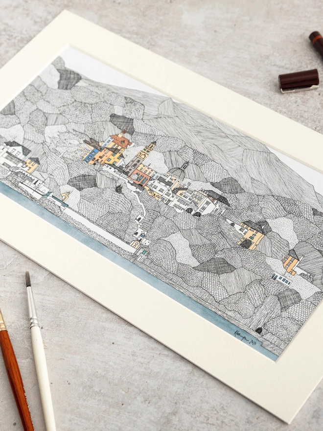 Print of detailed pen and watercolour drawing of Portmeirion and welsh hills, in a soft white mount