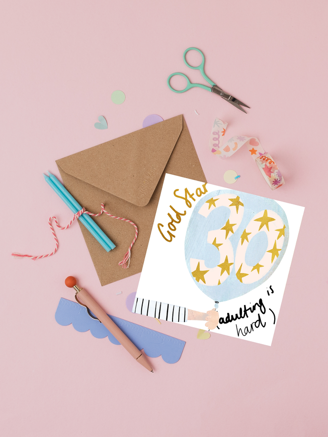 'adulting is hard' illustrated 30th birthday card. number 30 decorated with gold stars, drawn inside a blue balloon.
