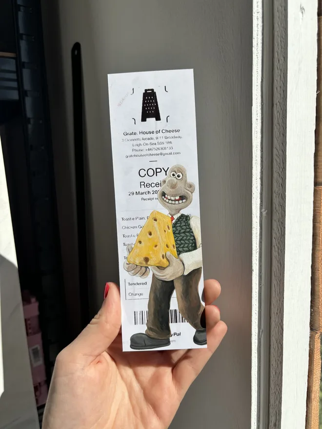 Wallace The Grate Receipt Print, against a plane background. 