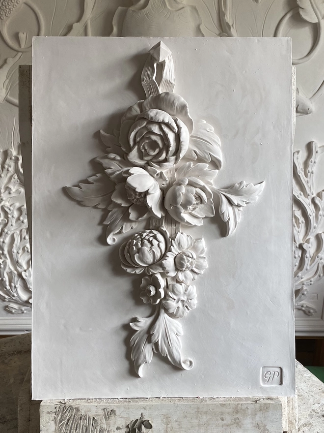 Flower Drop II white plaster wall sculpture with flower design 