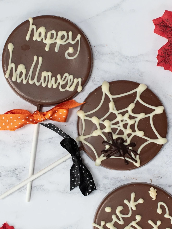 Happy Halloween, spiderweb chocolate lollipops