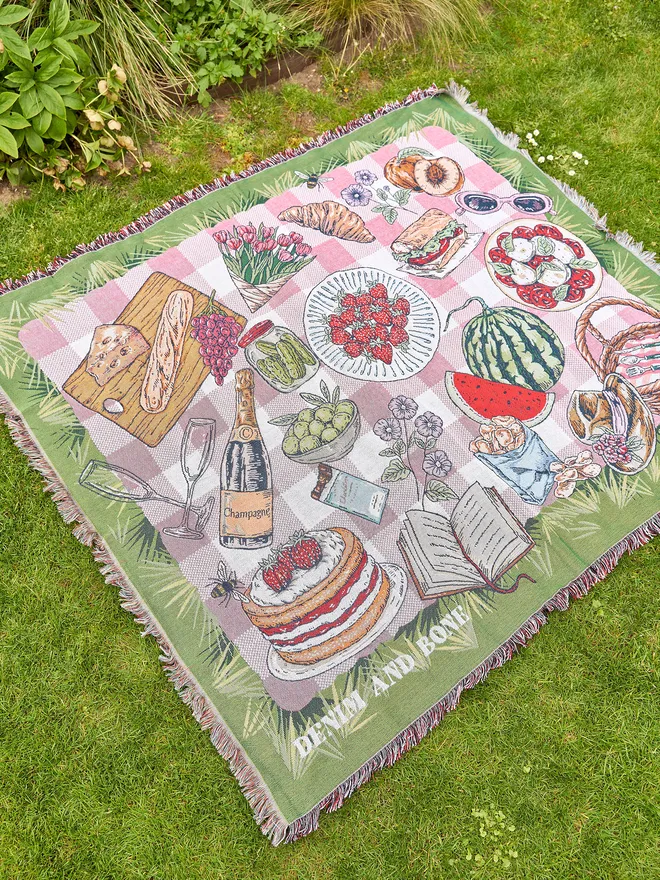 Picnic blanket placed outside on the grass 