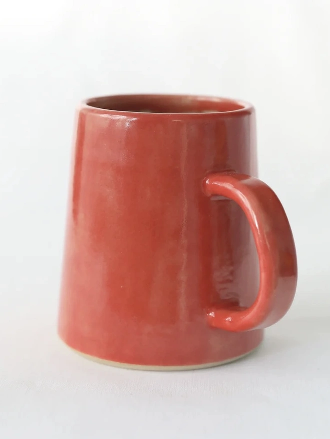 Ceramic Pint Mug, a colourful ceramic mug sitting on a white surface against a plain backdrop. 