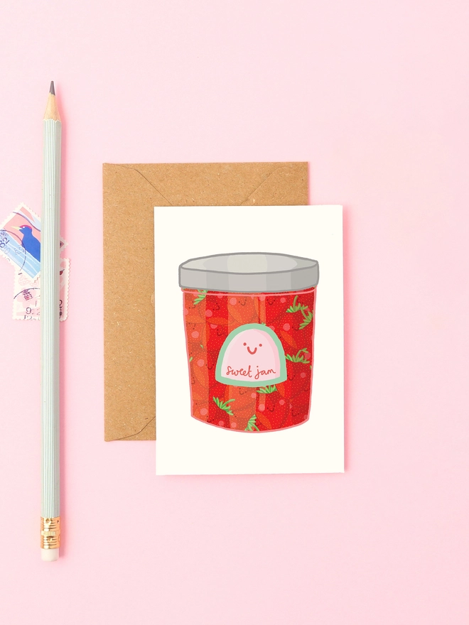 Cute mini card featuring a smiley jar of strawberry jam. 