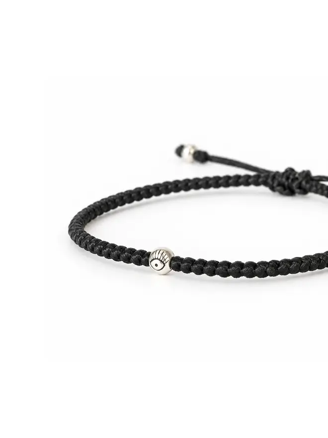 black cord bracelet silver evil eye bead close-up women’s handmade UK
