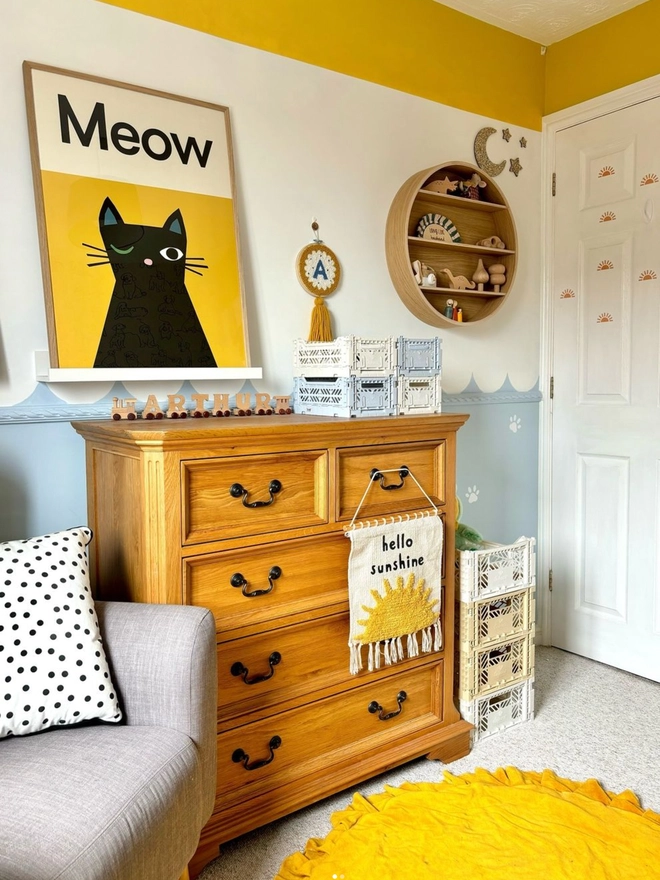 illustrated cat wall print in a childs bedroom