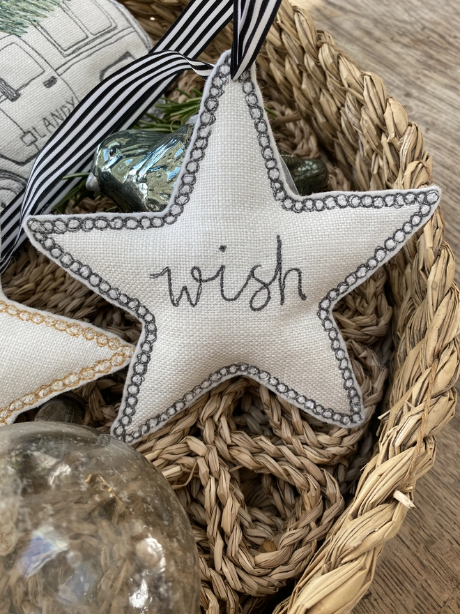 Fabric Embroidered Edge Star Decoration in a rattan bowl