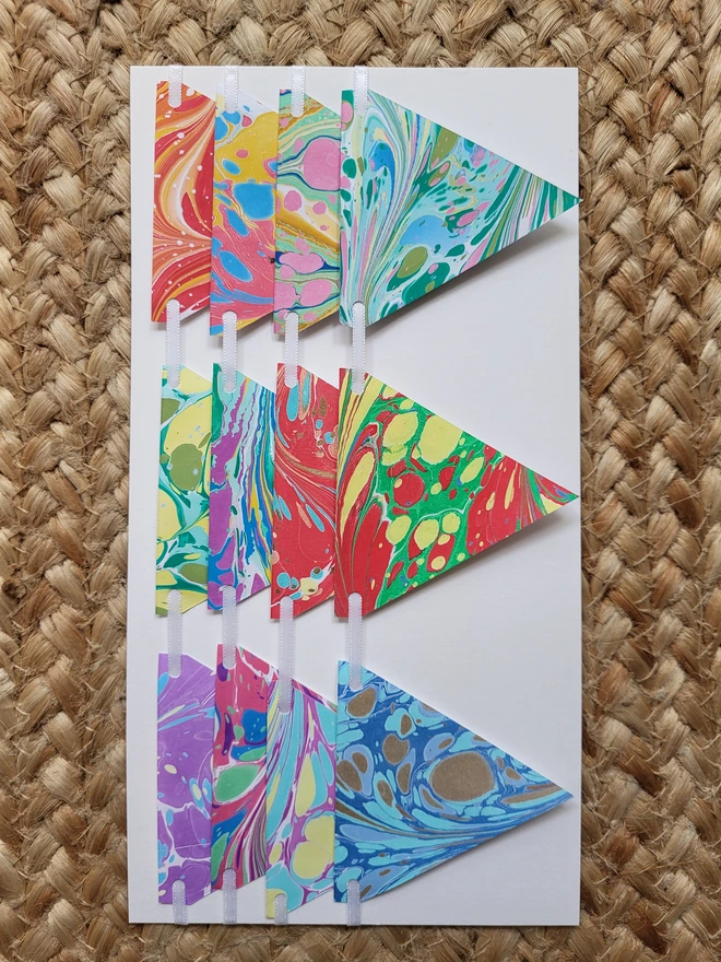 Hand-marbled paper bunting in multi-coloured rainbow tones