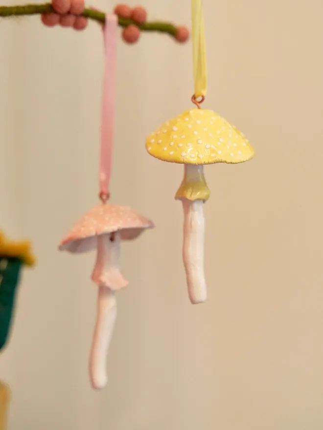 Handmade ceramic toadstool hanging decorations pink and yellow 