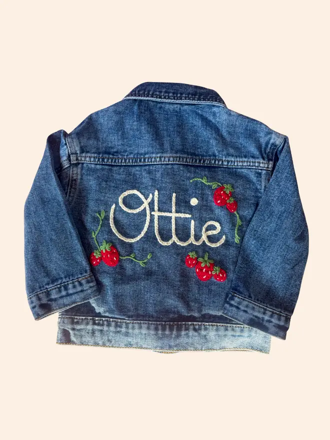 Hand-embroidered denim jacket with strawberries
