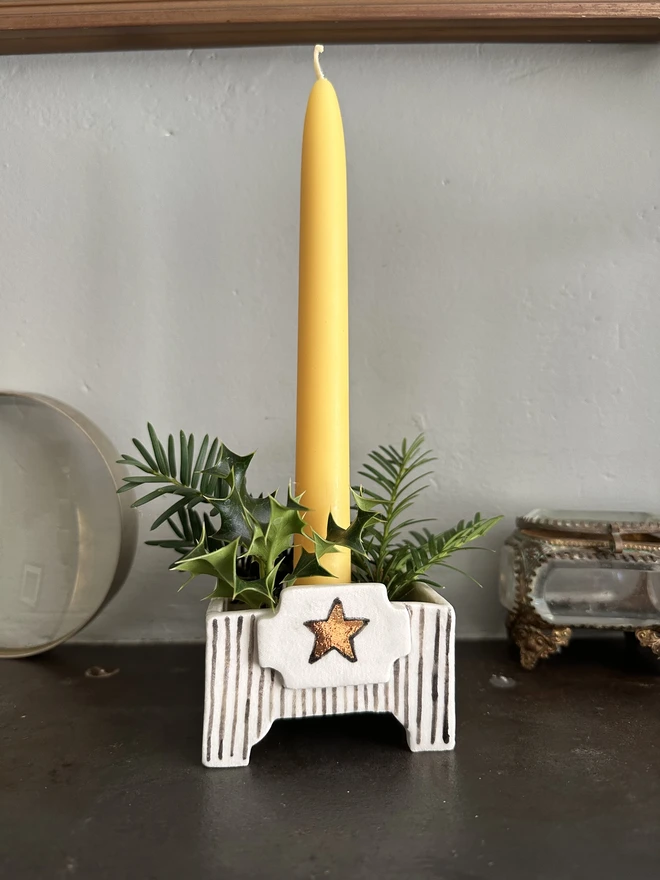 square star candle holder on mantlepiece