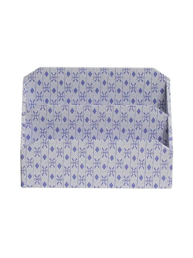 Tijan Letter Rack, a colourful patterned letter rack sitting on a white surface against a plain backdrop. 