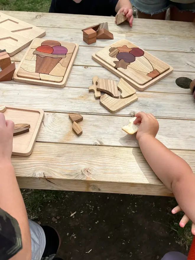 Sky Bloom Wooden Persistence Jigsaw Puzzle Heirloom Toy, on a  table. 