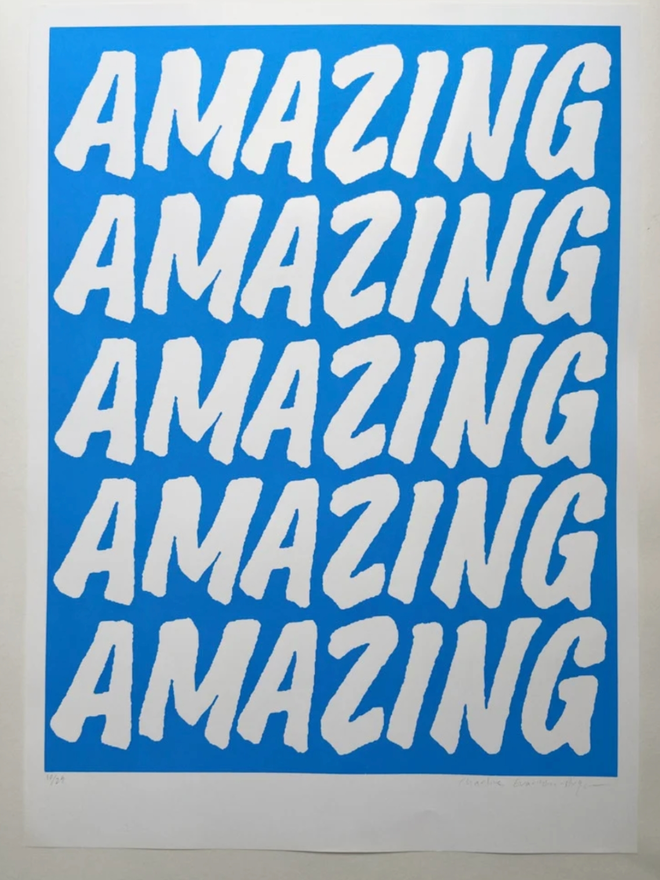 Fluoro Amazing Print. A vibrant blue background with AMAZING written five times.