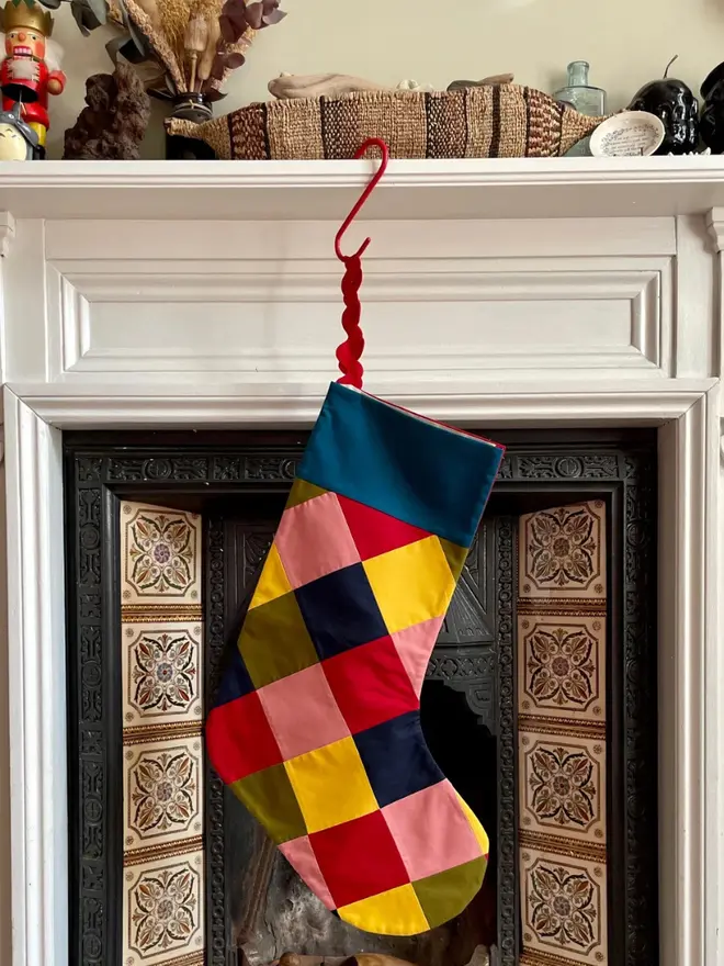 Harlequin Patchwork Stocking, hanging.