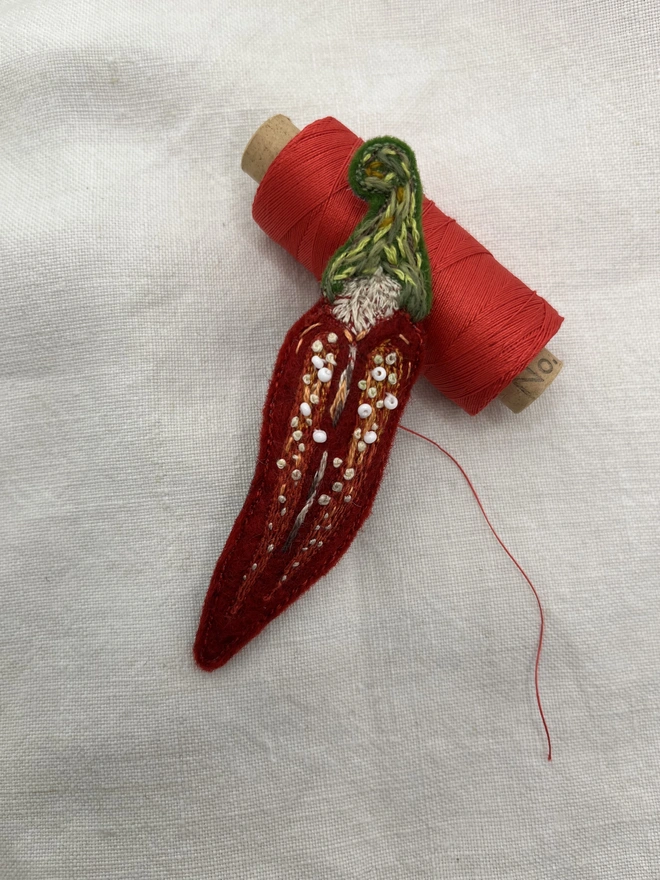 chilli with cotton reel