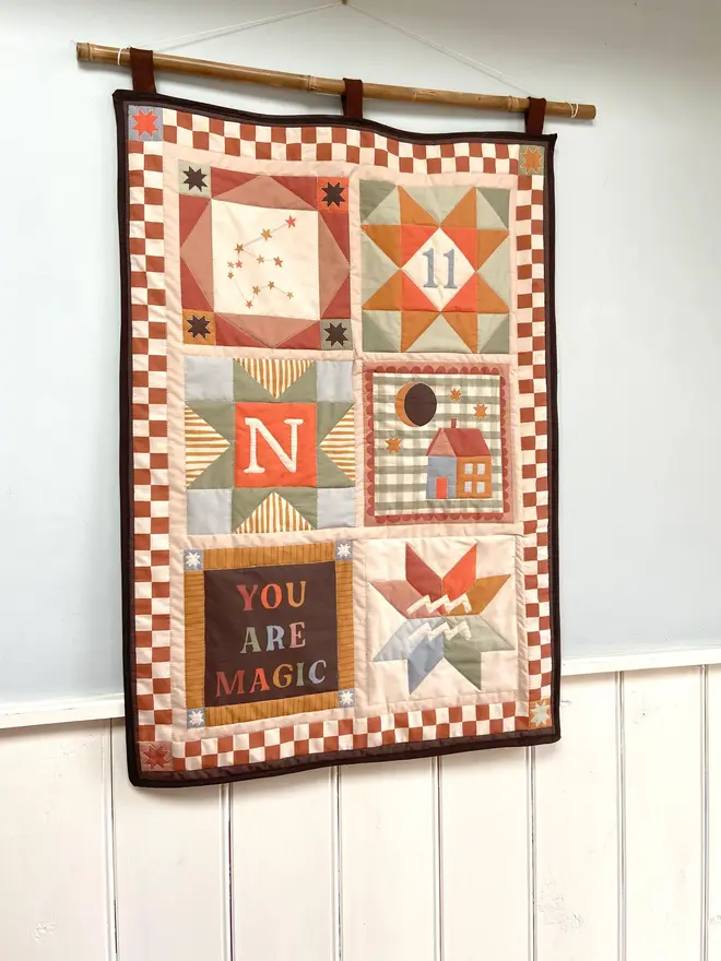 personalised baby quilted wall hanging. a patchwork hanging quilt decoration to commemorate a baby's birth.