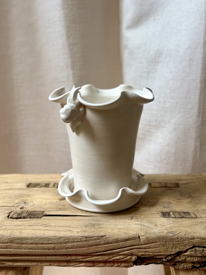 Frilly ceramic plant pot in white satin glaze with hand sculpted snail 