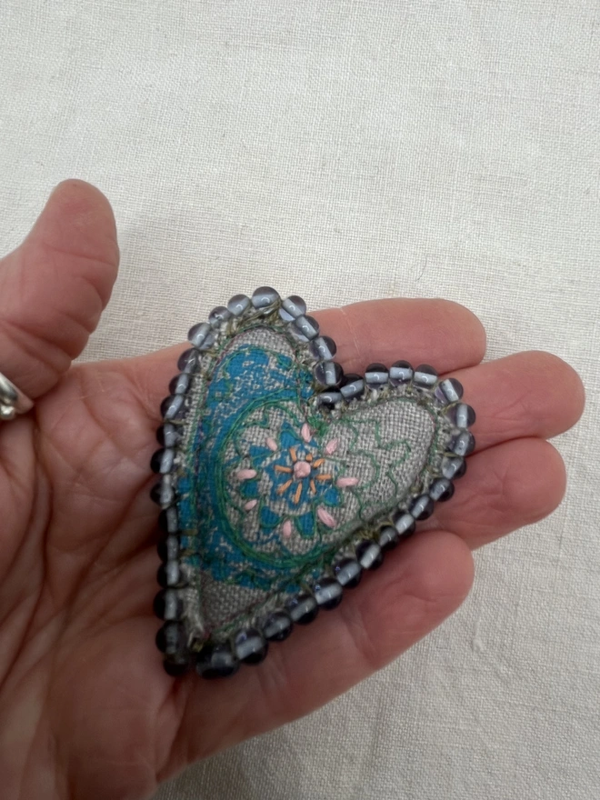 heart brooch with blue beads