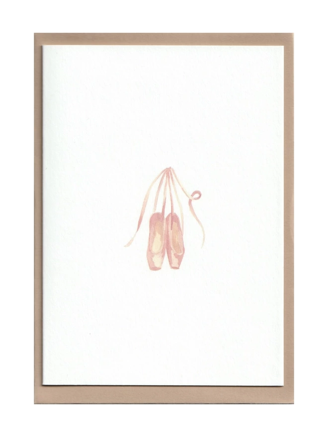 Greetings card with a watercolour illustration of a pair of ballet shoes with an oat coloured envelope