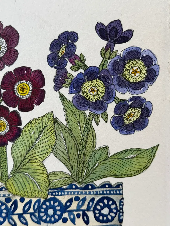 Auricular flowers in blue & white ceramic vessel