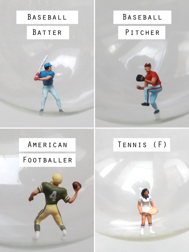 Miniature figures of a baseball pitcher and batter, and American football player  and female tennis player, in a Christmas bauble