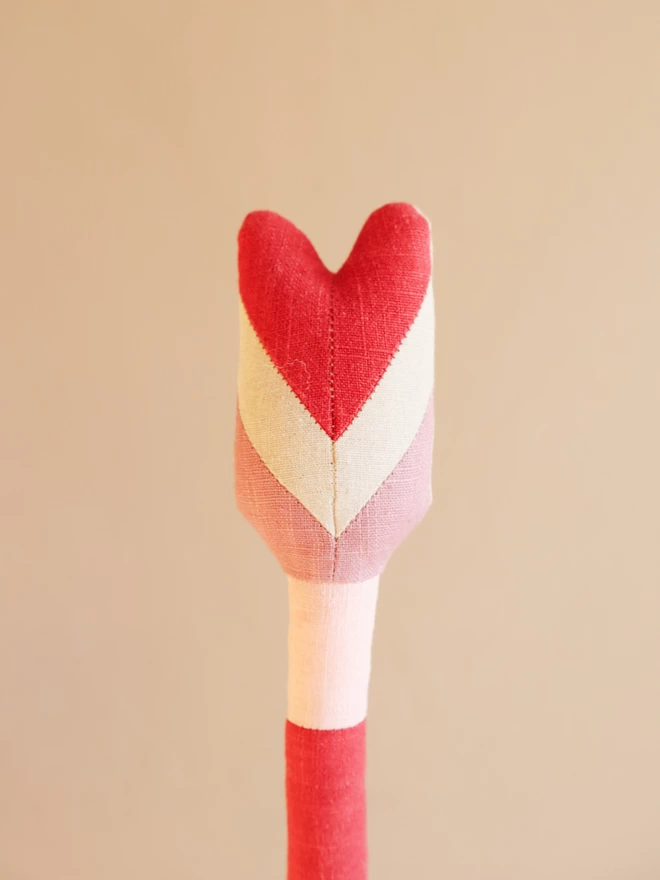 Linen arrow wall decoration in red and pink with l'amour de ma vie' embroidery